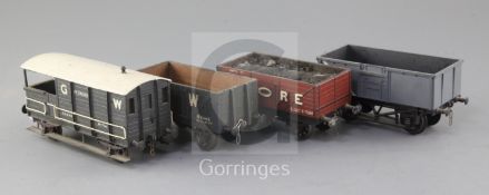 A Triang open truck, no.B71411, in grey, a G.W. open wagon 8T, no.42573, in black, a Moore open