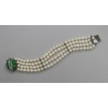 A modern multi strand cultured pearl bracelet with 14 ct white gold and jadeite clasp, 18 cm