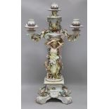 A German porcelain figural candelabrum H.62cm