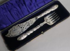 A cased pair of Victorian silver fish servers, Henry Howson, Sheffield, 1861, knife 32.5cm.