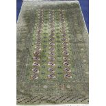 A Bokhara green ground carpet 255cm x 158cm