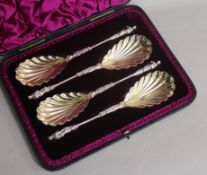 A cased set of four Victorian silver serving spoons with figural terminals, Edward Hutton, London,