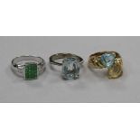 Three 18ct gold and gem set dress rings, including a white gold, green garnet? and diamond tablet