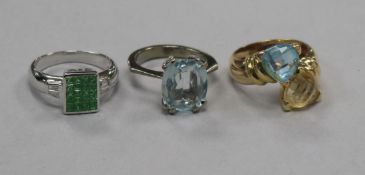 Three 18ct gold and gem set dress rings, including a white gold, green garnet? and diamond tablet