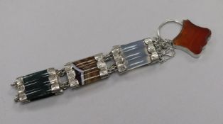 An early 20th century Scottish white metal and hardstone bracelet, one panel a.f.