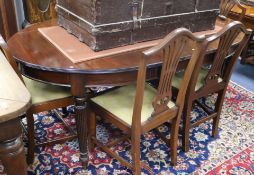 A George III style mahogany extending dining table and as set of six Hepplewhite style dining chairs