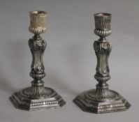 An ornate pair of 1960's cast silver candlesticks by A. Haviland-Nye, London, 1969, 15.2cm, 28.5 oz
