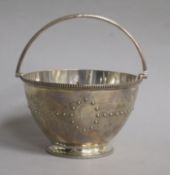 A Victorian silver sugar basket, by Thomas Bradbury & Sons, London, 1868, height 7.5cm, (no