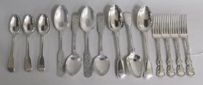 Ten items of mixed silver flatware and four silver plated table spoons. 20.5 oz.