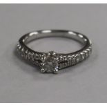 A Tokolwsky 18ct white gold and single stone diamond ring with box with diamond set shoulders,