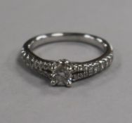 A Tokolwsky 18ct white gold and single stone diamond ring with box with diamond set shoulders,