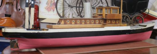 A model of a steam boat with glazed wheel house Length 168cm