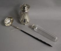 A George III silver toddy ladle, a silver sugar caster and a silver topped toilet bottle.