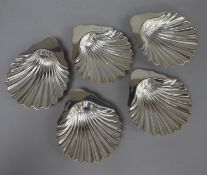 A pair of Victorian silver butter shells, London, 1886, 12cm and a later set of three silver