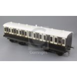 A Gauge 1 non-corridor coach, chocolate and cream coloured, 50cm long with auto coupling