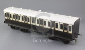 A Gauge 1 non-corridor coach, chocolate and cream coloured, 50cm long with auto coupling