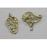 Two yellow metal foliate design pendants.