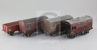 An open wagon, LMS, no.9097, in red, a GWR horse box, no.8173, in red, an LMS horse box, no.456,