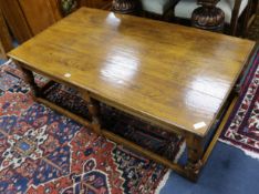 A large oak rectangular topped coffee table W.144cm.