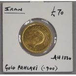 An Iranian One Pahlavi gold coin, Mohammad Reza Shah, in sealed mount 8.1g net, AEF