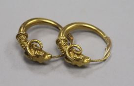 A pair of Polish 14ct gold 'rams head' hoop earrings.