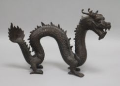 A 19th century Chinese bronze of a dragon Length 26cm. Height 17cm.