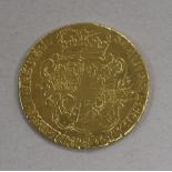 A gold copy of a George II half guinea, 1750, 4.1g