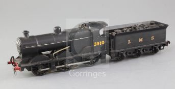 A 4F 0-6-0 LMS tender locomotive, number 3910, black livery, 3 rail with skate, overall 37cm