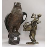 A bronze model of an eagle and a bronze figure