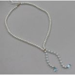 A single strand freshwater pearl and blue topaz tassel drop necklace, with 9ct gold clasp, approx.