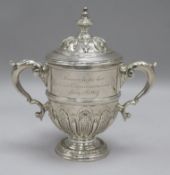 A silver "Faulkner Commemoration" miniature trophy cup and cover by William Comyns & Sons, London,