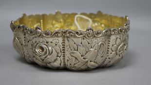 A Victorian repousse silver cusped bowl by William Comyns, London, 1885, 14.2cm, 7 oz.