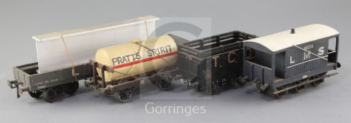 An LMS wagon 30T with girder load, no.7960, in grey, a TCD Ltd cattle truck, no.171, in black, a