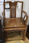 A pair of Chinese carved hardwood elbow chairs