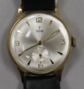 A gentleman's 1960 9ct gold Tudor manual wind wrist watch, on leather strap with Rolex buckle,