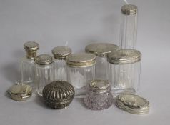 Part sets of silver-mounted glass toilet jars, etc., comprising eight bottles of various shapes