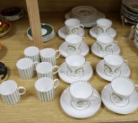 A Susie Cooper 26 piece 'Assyrian' motif tea set and a Susie Cooper 12 piece coffee set, cups