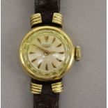 A Longines lady's 18ct gold wrist watch