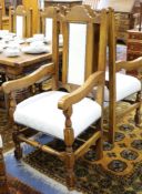 A set of 12 17th century style oak dining chairs