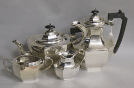 A silver matched four-piece tea service, of oval octagonal baluster form, comprising teapot and