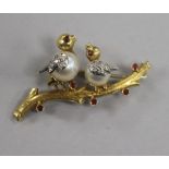 A modern 18ct gold, cultured pearl, diamond and gem set brooch, modelled as two birds upon a branch,