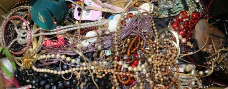 A box of mixed costume jewellery.