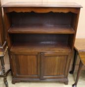 A mahogany bookcase/cupboard W.91cm.