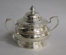 A modern silver two handled bowl and cover by Adie Bros, London, 1977, height 11.5cm, 8 oz.