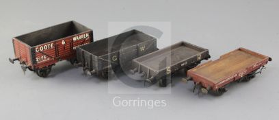 An SR flat wagon, no.6835, in black, a flat wagon, no.70189, in red, a Coote & Warren open wagon,