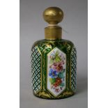 A 19th century green glass and enamelled scent bottle