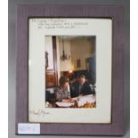 A signed photo of Margaret Thatcher and Michael Aitken