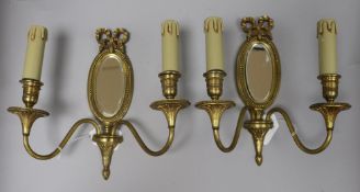 A pair of Louis XVI gilded bronze two branch mirrored sconces height 27cm