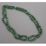 A single strand jadeite bead necklace with 9ct gold clasp, 129cm.