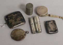 Three silver vesta cases and three other items including coin holder and silver cased tape measure.
